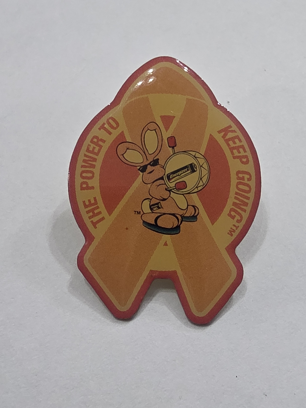 Energizer Orange Ribbon Bunny Brooch - Keep Going™